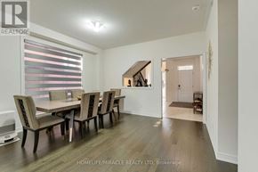Innisfil (Lefroy) apartment for rent - A dining room with a table and chairs and a window with blinds.