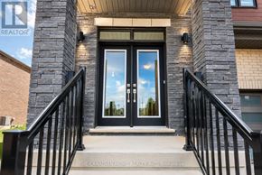 Woolwich apartment for rent - The entrance to a building with a glass door and a sign that reads "The Canadian Home Realty Inc. Brokerage."