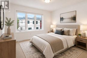 Woolwich apartment for rent - A bedroom with a large bed, a nightstand, and a window overlooking a cityscape.