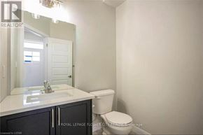 London South (South W) townhouse for rent - A white bathroom with a toilet and sink.