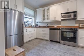 Lincoln (Lincoln-Jordan/Vineland) apartment for rent - A kitchen with a stainless steel refrigerator, oven, and microwave.