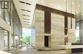 Burnaby apartment for rent - A modern interior space with marble walls and a reception desk.