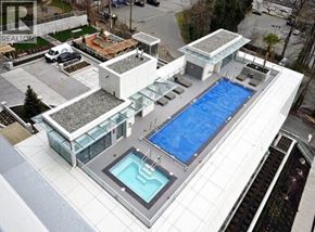 Burnaby apartment for rent - A modern house with a pool and a hot tub.