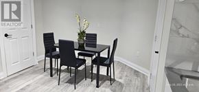 Markham (Wismer) apartment for rent - A dining room with a table and chairs.