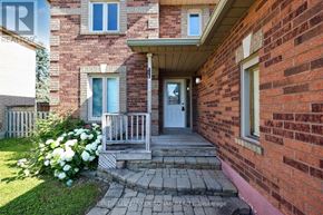 New Tecumseth (Beeton) apartment for rent - A brick house with a white door and a small porch.