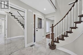 New Tecumseth (Beeton) apartment for rent - A spacious hallway with a staircase and a door.