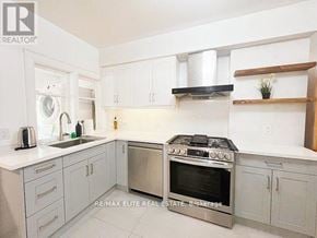 Toronto (Oakwood Village) apartment for rent - A kitchen with white cabinets and a stainless steel oven.