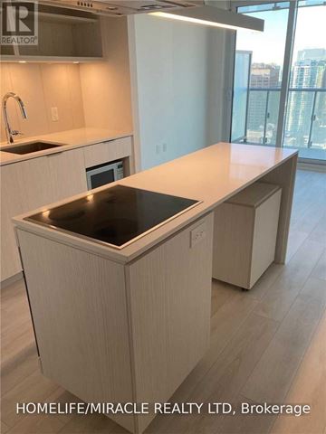 Toronto (Waterfront Communities) condo for rent - A kitchen with a sink and a window.