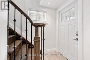 Toronto (Wexford-Maryvale) apartment for rent - A white door is on the right side of a staircase.