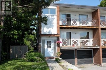 Markham (Old Markham Village) multi-family for rent - A two-story apartment building with a balcony on the second floor.