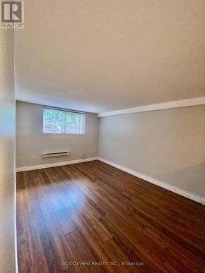 Markham (Old Markham Village) multi-family for rent - A room with wooden flooring and a window.
