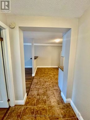 Markham (Old Markham Village) multi-family for rent - A hallway with a tiled floor and white walls.
