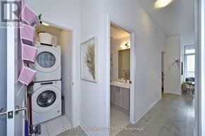 Vaughan (Concord) condo for rent - A laundry room with a washer and dryer stacked on top of each other.