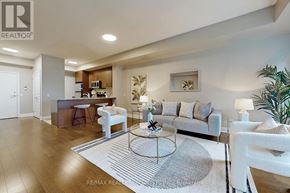 Mississauga (Port Credit) condo for rent - A modern living room with a white sofa set and a coffee table.