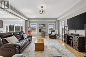 Southgate apartment for rent - A living room with a brown leather couch and a wooden coffee table.
