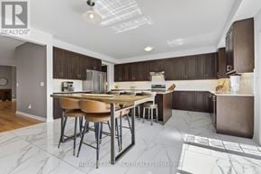 Southgate apartment for rent - A modern kitchen with a dining table and chairs.