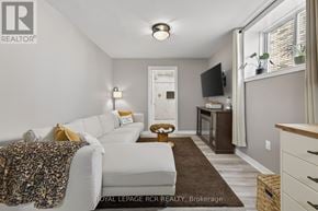 Southgate apartment for rent - A living room with a white couch and a brown rug.