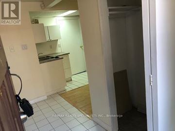 Toronto (Hillcrest Village) apartment for rent - A kitchen area with white cabinets and a countertop.
