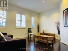 Richmond Hill (Westbrook) apartment for rent - A living room with a brown couch, a wooden coffee table, and a chair.