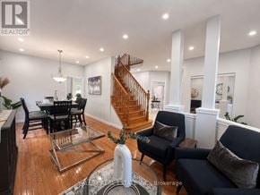 Kitchener apartment for rent - A living room with a wooden floor and a staircase.