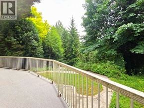 West Vancouver apartment for rent - A metal railing on a concrete walkway.