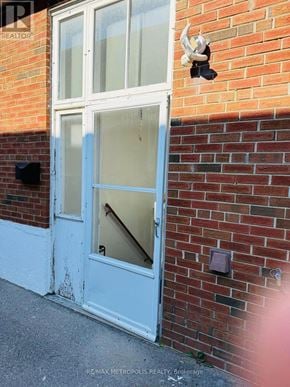 Toronto (Glenfield-Jane Heights) apartment for rent - A white door with a glass panel is closed.
