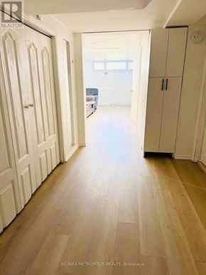 Toronto (Glenfield-Jane Heights) apartment for rent - A hallway with white doors and a wooden floor.