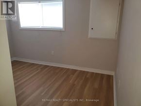 Brampton (Northwest Brampton) townhouse for rent - A room with a window and wooden flooring.