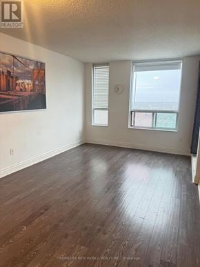 Toronto (Bendale) condo for rent - A room with wooden flooring and a painting on the wall.