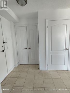 Toronto (Bendale) condo for rent - A white door with a black handle is in a room with white walls.