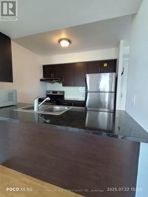 Toronto (Bendale) condo for rent - A kitchen with a stainless steel refrigerator and a sink.
