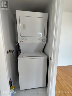 Toronto (Bendale) condo for rent - A white dishwasher is in a small space next to a wall.