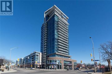 Mississauga (Port Credit) condo for rent - A tall building with many windows is the main focus of the image.