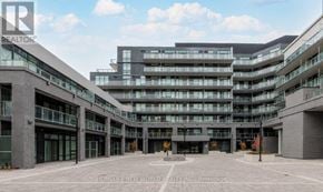 Toronto (Bayview Village) condo for rent - A large, modern building complex with a clear sky above.