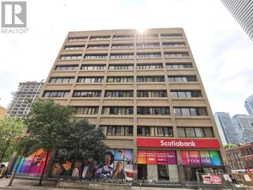 Toronto (Church-Yonge Corridor) condo for rent - A tall building with a Scotiabank branch in front.