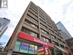 Toronto (Church-Yonge Corridor) condo for rent - A Scotiabank branch with a sign that says "Look on the Pride side.".