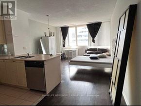 Toronto (Church-Yonge Corridor) condo for rent - A bedroom with a bed and a kitchen area.