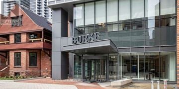 Toronto (North St. James Town) condo for rent - A Burke sign is on a building.