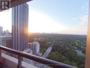 Toronto (North St. James Town) condo for rent - A sunset view from a balcony overlooking a cityscape.