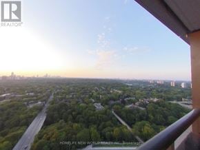 Toronto (North St. James Town) condo for rent - A view from a balcony looking out over a cityscape at sunset.
