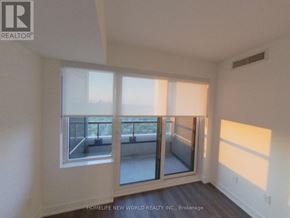 Toronto (North St. James Town) condo for rent - A room with a large window and a sliding glass door.