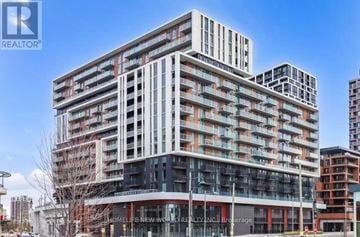 Markham (Unionville) condo for rent - A modern multi-story building with the words "HOMELESS NEW WORLD REALTY INC. Brokerage" on the front.