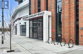 Markham (Unionville) condo for rent - The image shows a street view with a building that has a sign reading "819 Birchmount Road" and a realtor logo.