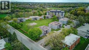 London apartment for rent - An aerial view of a residential area with apartment buildings and green lawns.