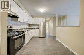 London apartment for rent - A kitchen with a stove top oven and a dishwasher.