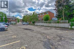 Waterloo apartment for rent - A parking lot with a Realtor logo in the corner.
