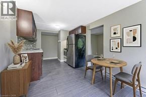 Waterloo apartment for rent - A kitchen with a table and chairs in the middle of the room.
