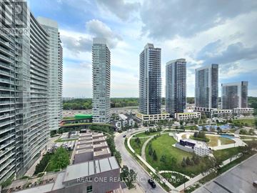 Toronto (Bayview Village) condo for rent - A view of a city with tall buildings and a green park area.