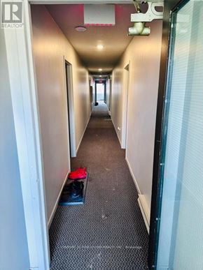 New Tecumseth (Alliston) multi-family for rent - A hallway with a pair of shoes on the floor.