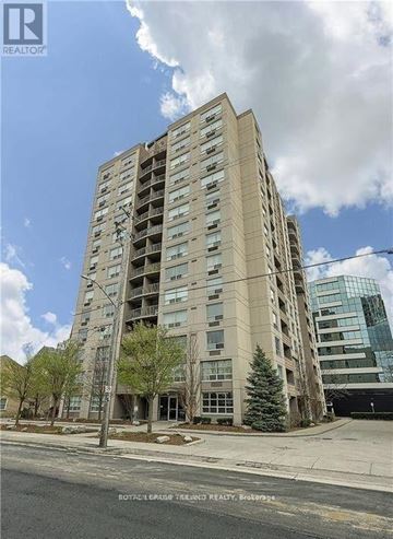 London East (East F) condo for rent - A tall residential building with a balcony on the second floor from the front.